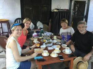 Recent Pokhara tour group enjoys Tibetan tea at a the home of a local Tibetan family