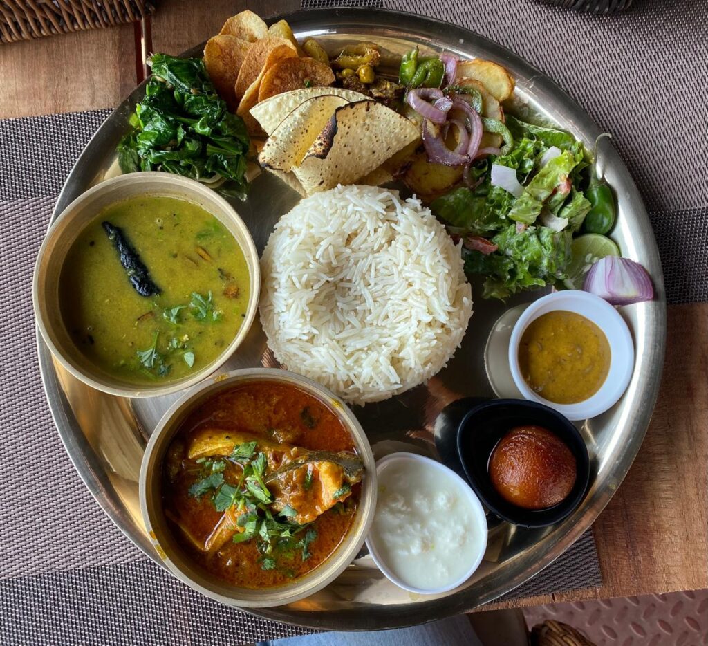 Traditional Nepali Dal Bhat meal served with lentils, rice, and vegetables