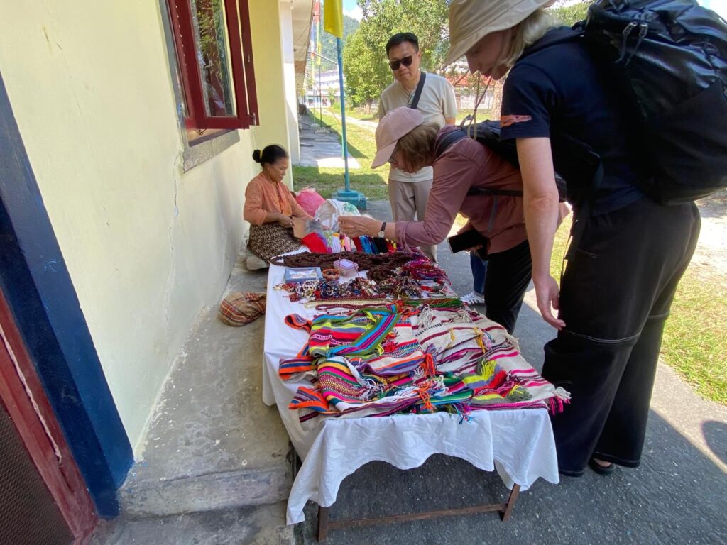 Tibetan women selling souvenirs in a Tibetan refugee settlement in Nepal