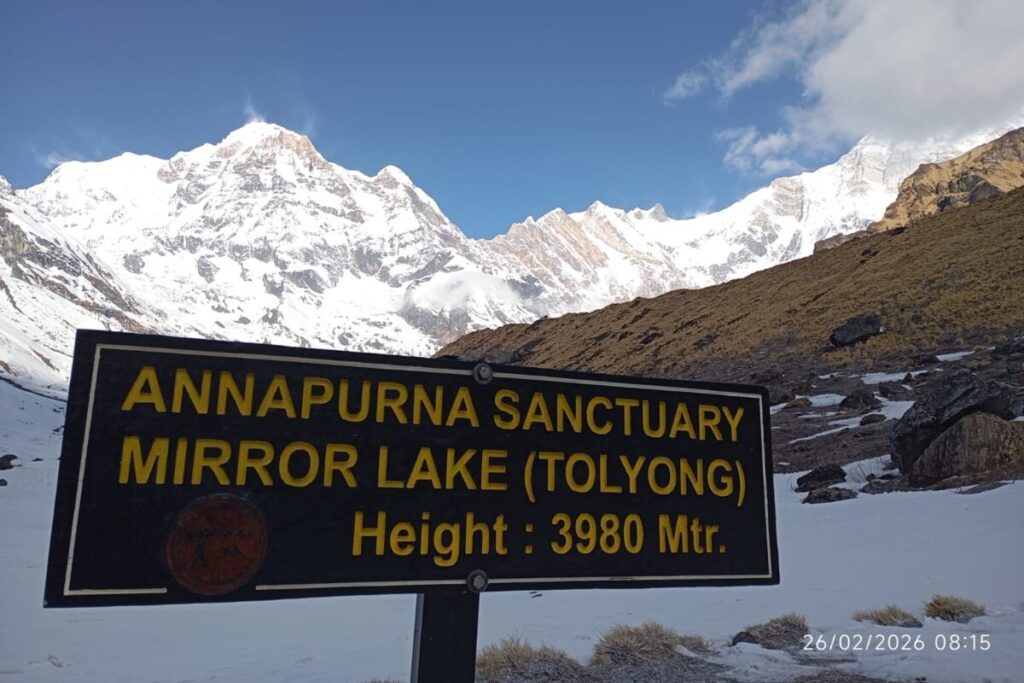 Annapurna Sanctuary Mirror Lake (Toliyong) sign at 3980 meters during the Annapurna Base Camp Trek in Nepal