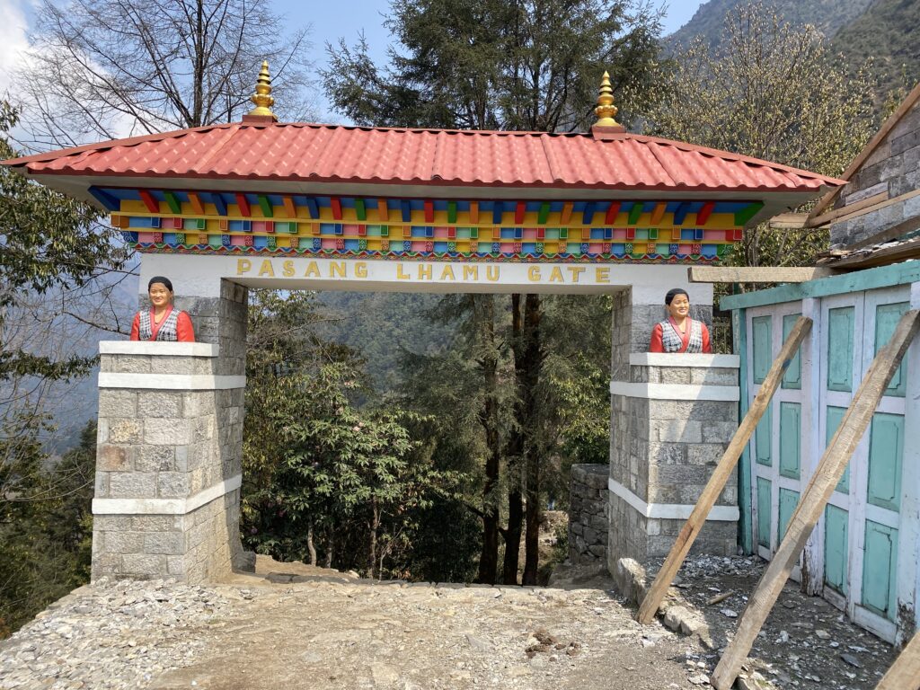 Colorful Pasang Lhamu Gate with Buddhist statues at the entrance of Lukla trail Nepal