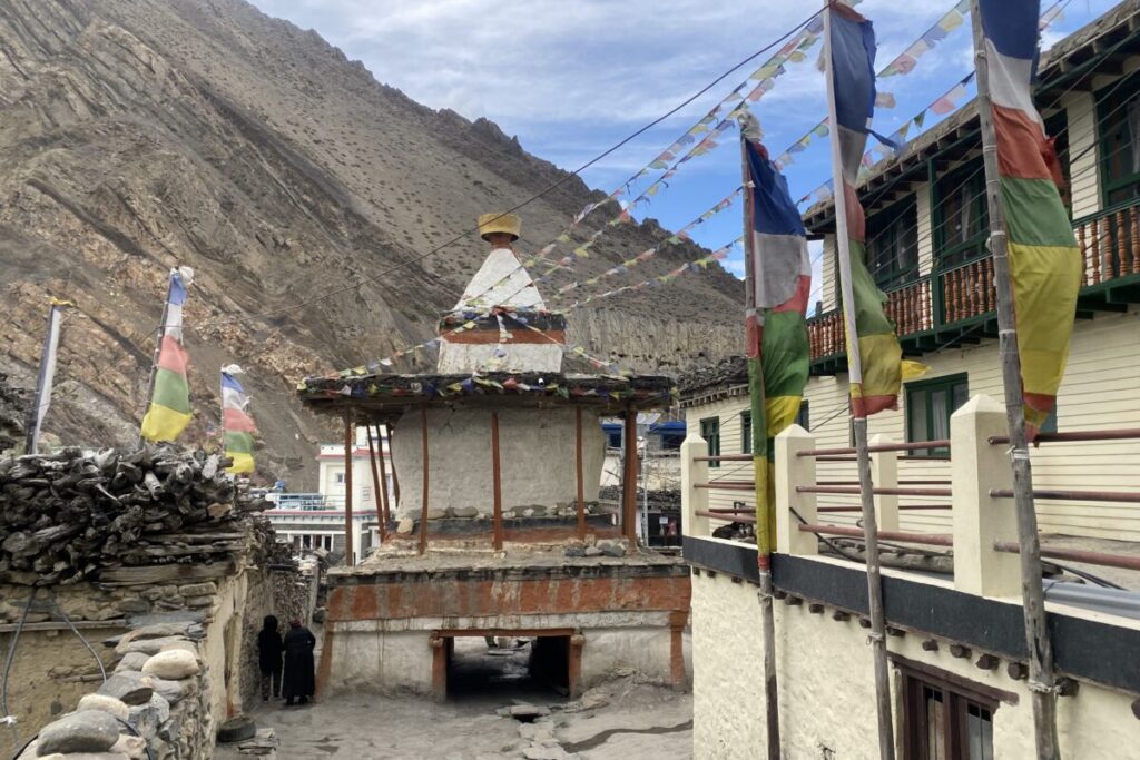 Trekkers walking through the medieval village of Kagbeni after completing the Thorong La Pass Trek crossing in Nepal