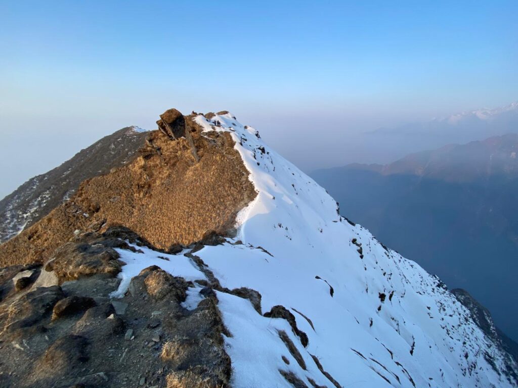 Snow-covered high altitude ridge at Mardi Himal viewpoint 4500m with Himalayan panorama