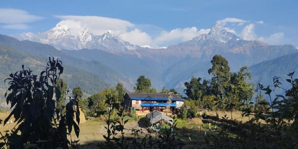 Traditional Gurung village house with Annapurna range on the Astam Village to Dhampus trek