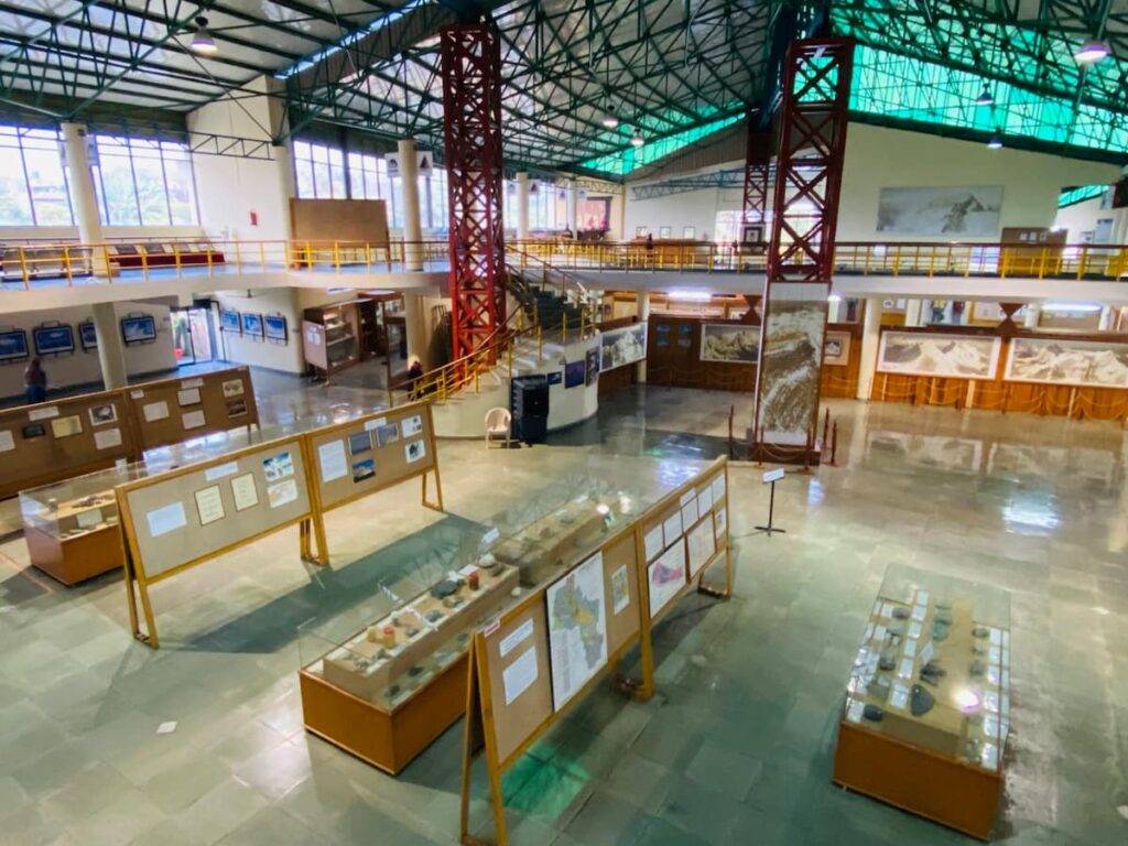 Spacious exhibition hall displaying Himalayan climbing gear and expedition history inside the International Mountain Museum
