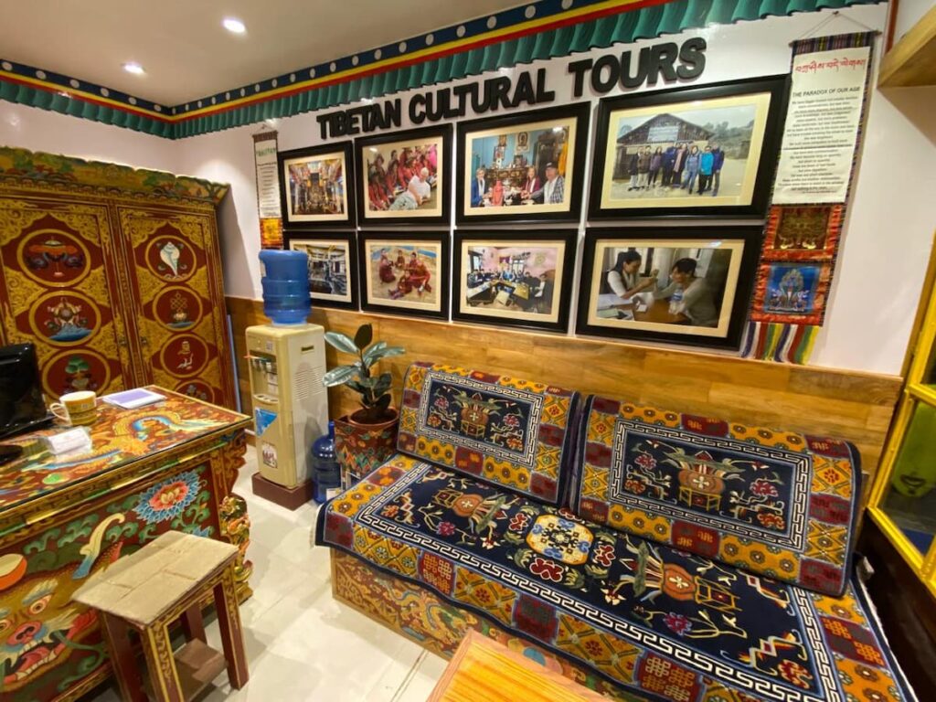 Interior of Tibetan Encounter office in Lakeside Pokhara with traditional Tibetan furniture and cultural tour display