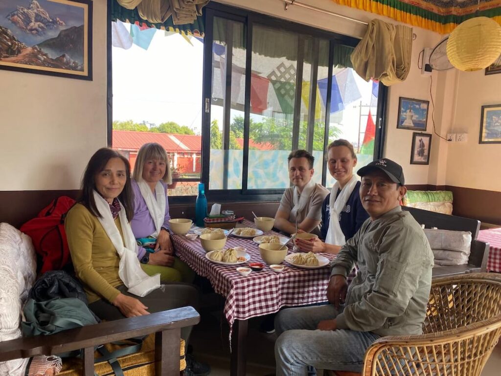 Guests enjoying traditional momos and thenthuk lunch — half day cultural tour in Pokhara
