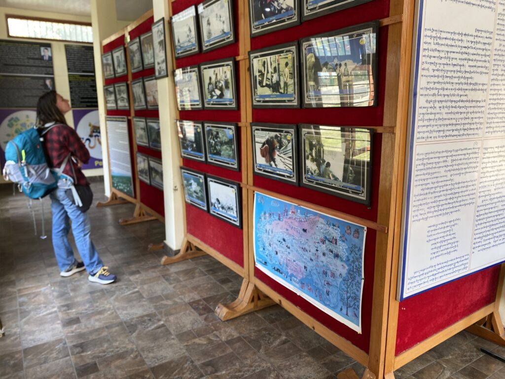 Visitor viewing rare historical photographs of Tibetan refugees at the Tibetan Photo Gallery in Pokhara