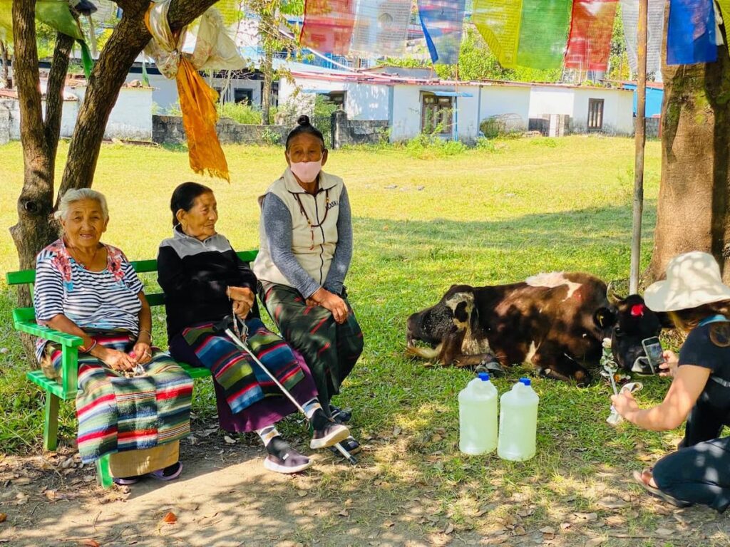 Elderly Tibetan women at refugee settlement during a Pokhara cultural day tour