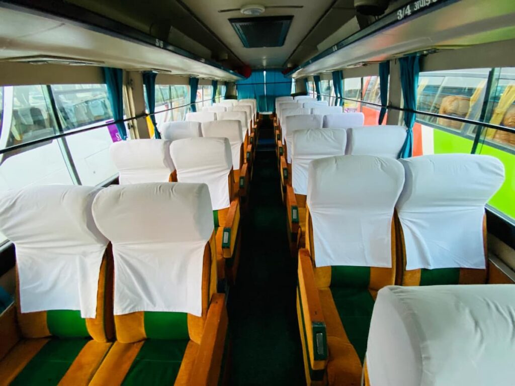 Comfortable tourist coach bus interior for the journey to Pokhara Nepal.