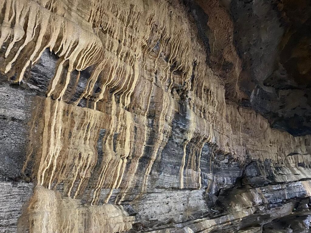 Ancient limestone rock formations and stalactites inside Gupteshwor Mahadev Cave, a sacred underground Shiva temple in Pokhara