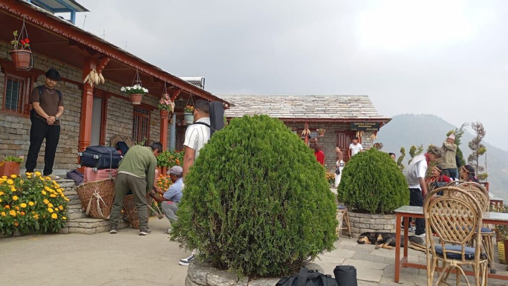 Trekkers and porters at Gurung Cottage tea house lodge in Ghandruk village on the Annapurna trek from Pokhara