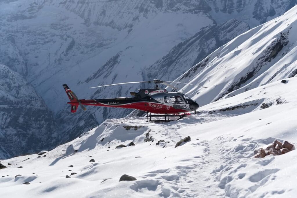 ABC heli tour from Pokhara helicopter parked on Annapurna Base Camp ridge