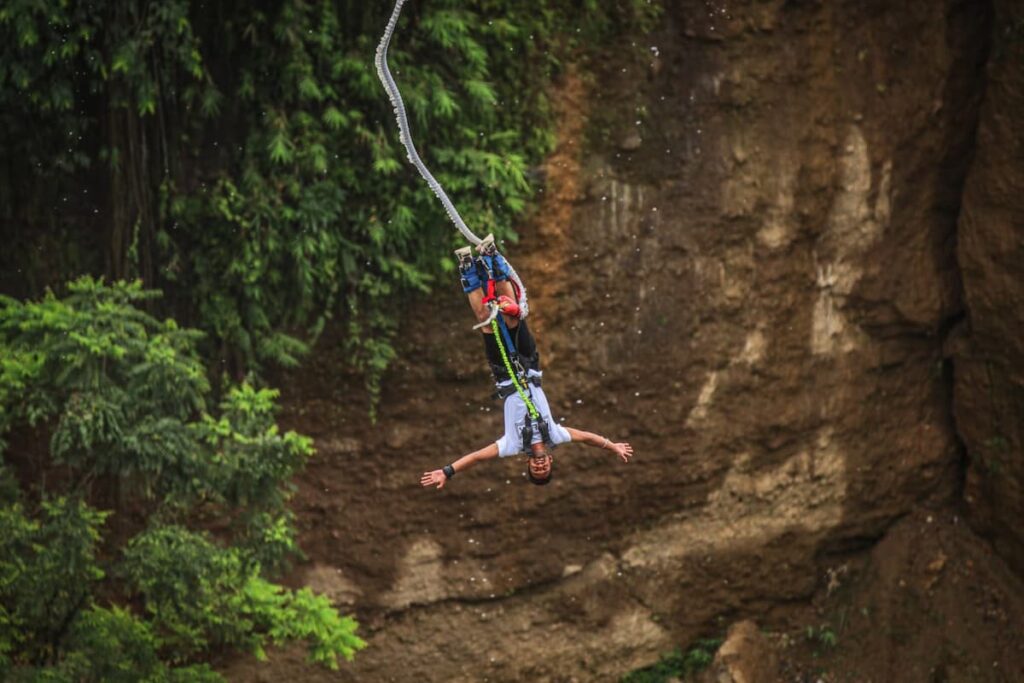 Thrill-seeker enjoying adventure sports in Pokhara during free fall