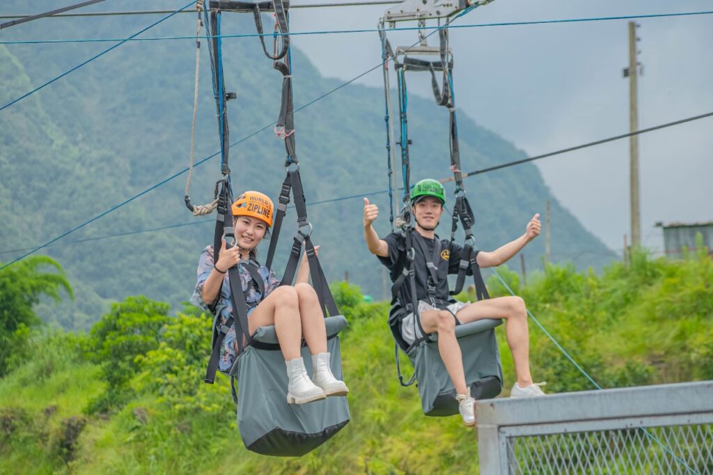 Two happy guests give a thumbs up after their Pokhara zipline ride