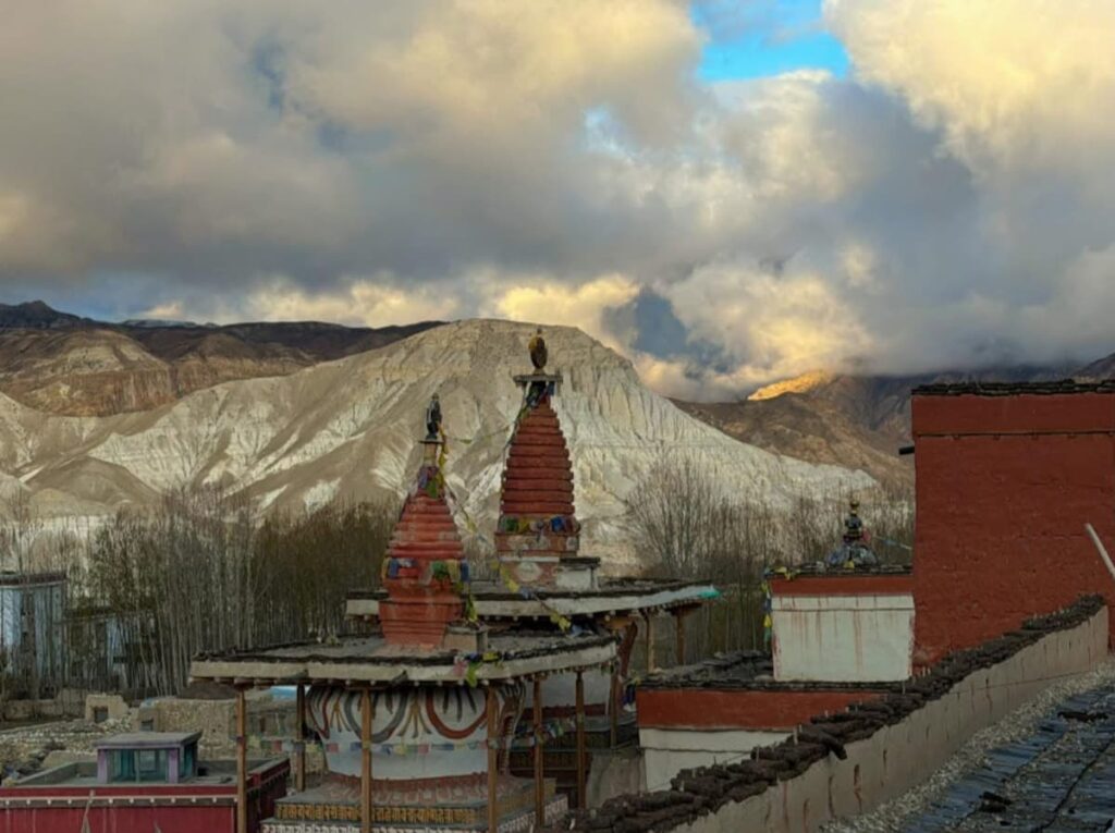 Sunset over ancient chortens and monastery rooftops in Lo-Manthang, Nepal